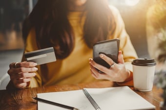 Woman checking her online banking and credit card