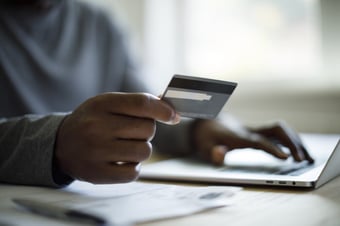 Man making an online payment with a credit card