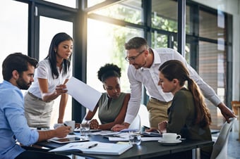 Team reviewing a report during a meeting